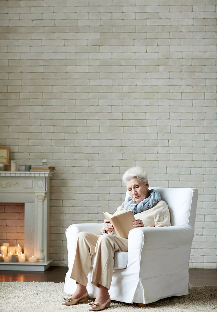 Older adult enjoying a calm daily routine with caregiver support