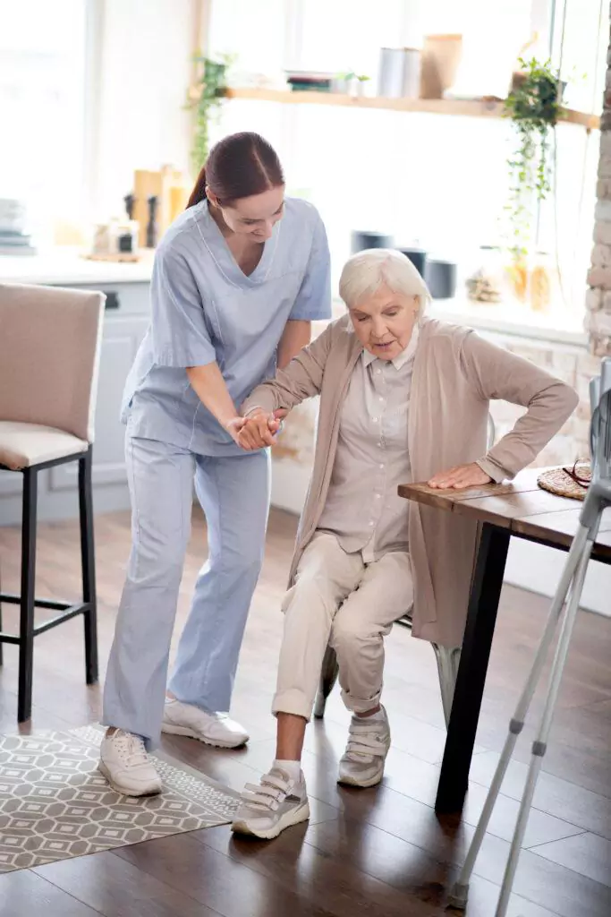 Older adult receiving daily residential support from a caregiver