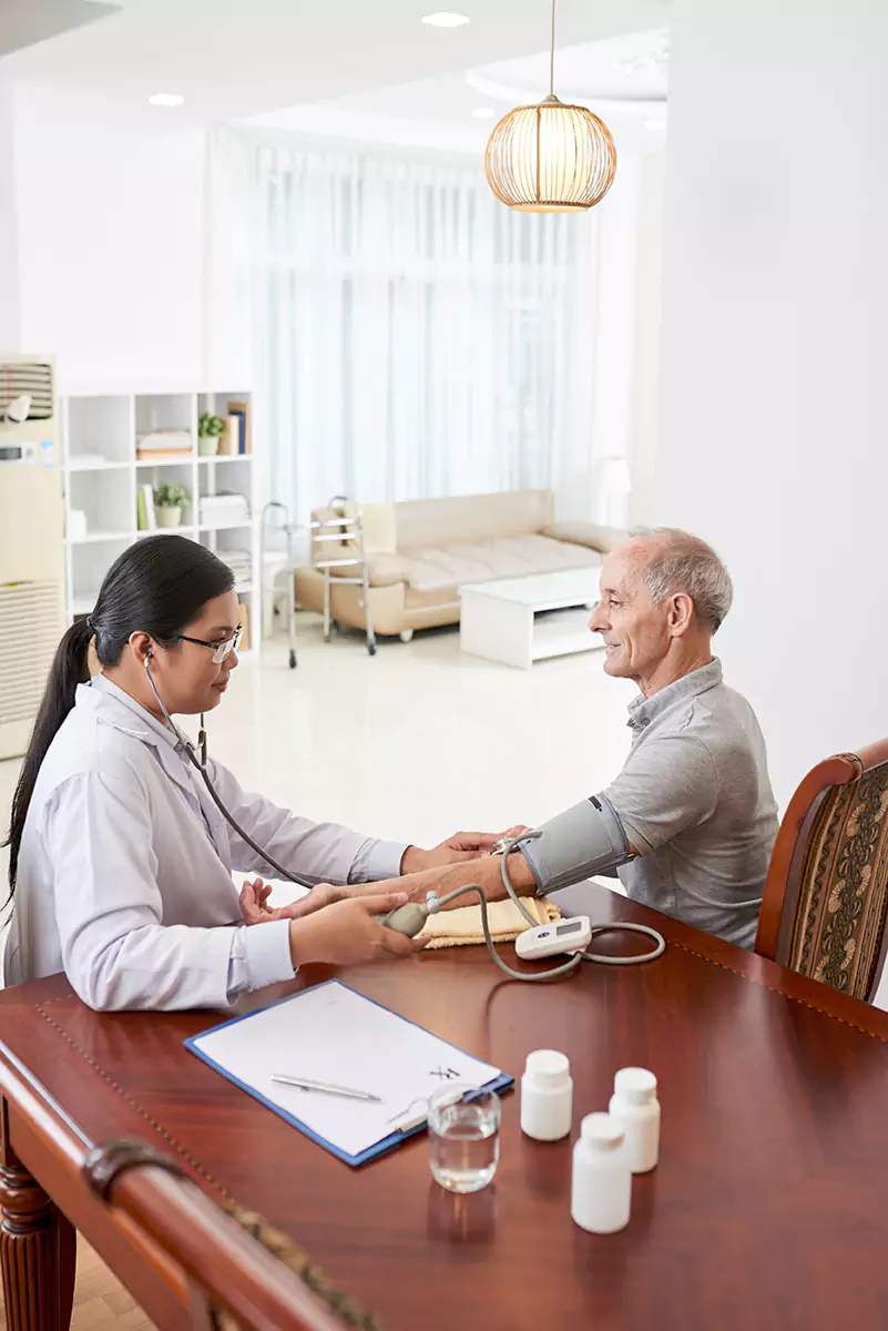 Care professional reviewing post-hospital admission plans with an older adult and family